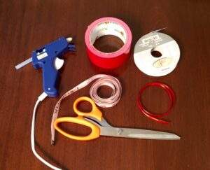 materials for bow ties- ribbon measuring tape glue duct tape scissors