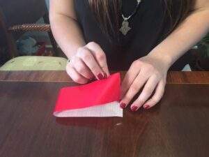 duct tape being folded for bow ties