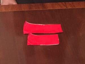 fold both pieces of tape in half