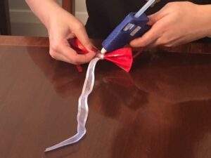 glue ribbon into place